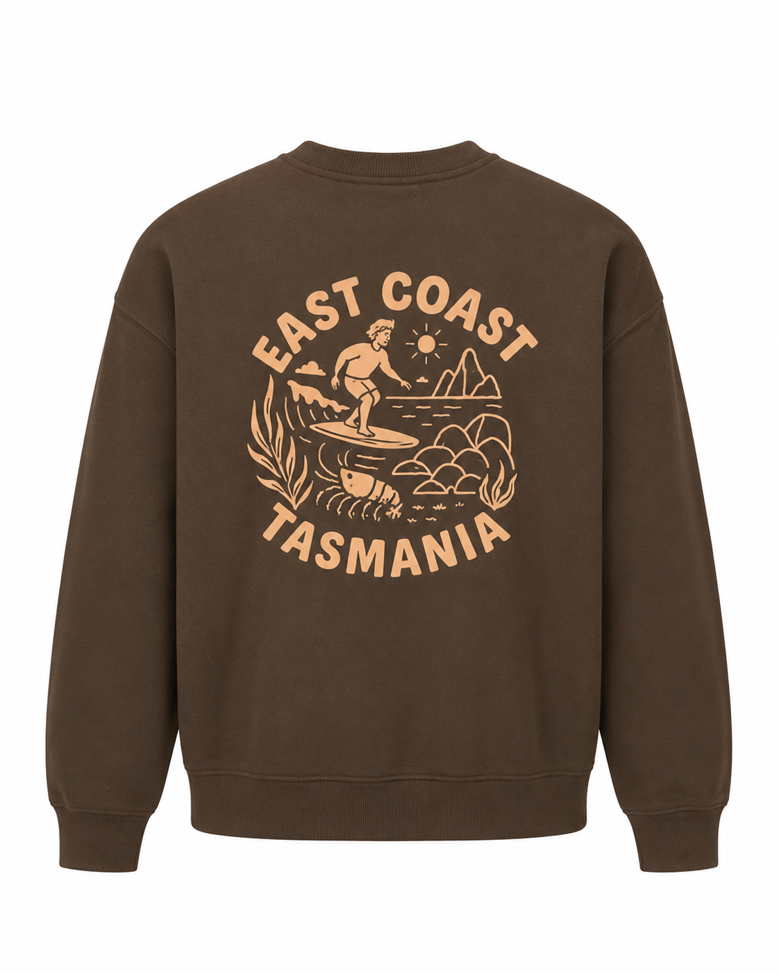 A brown crewneck sweatshirt shown from the back, featuring a large tan graphic print with a surfer, mountains, and the text 'EAST COAST TASMANIA'.